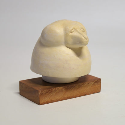 Hapi "baboon head" canopic vase lid on wooden base