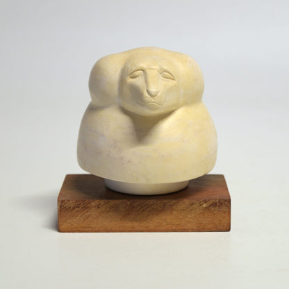 Hapi "baboon head" canopic vase lid on wooden base