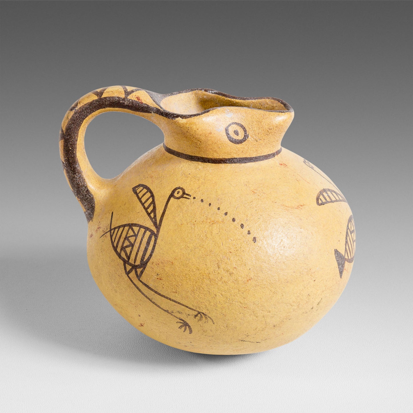 Small bird-decorated jug