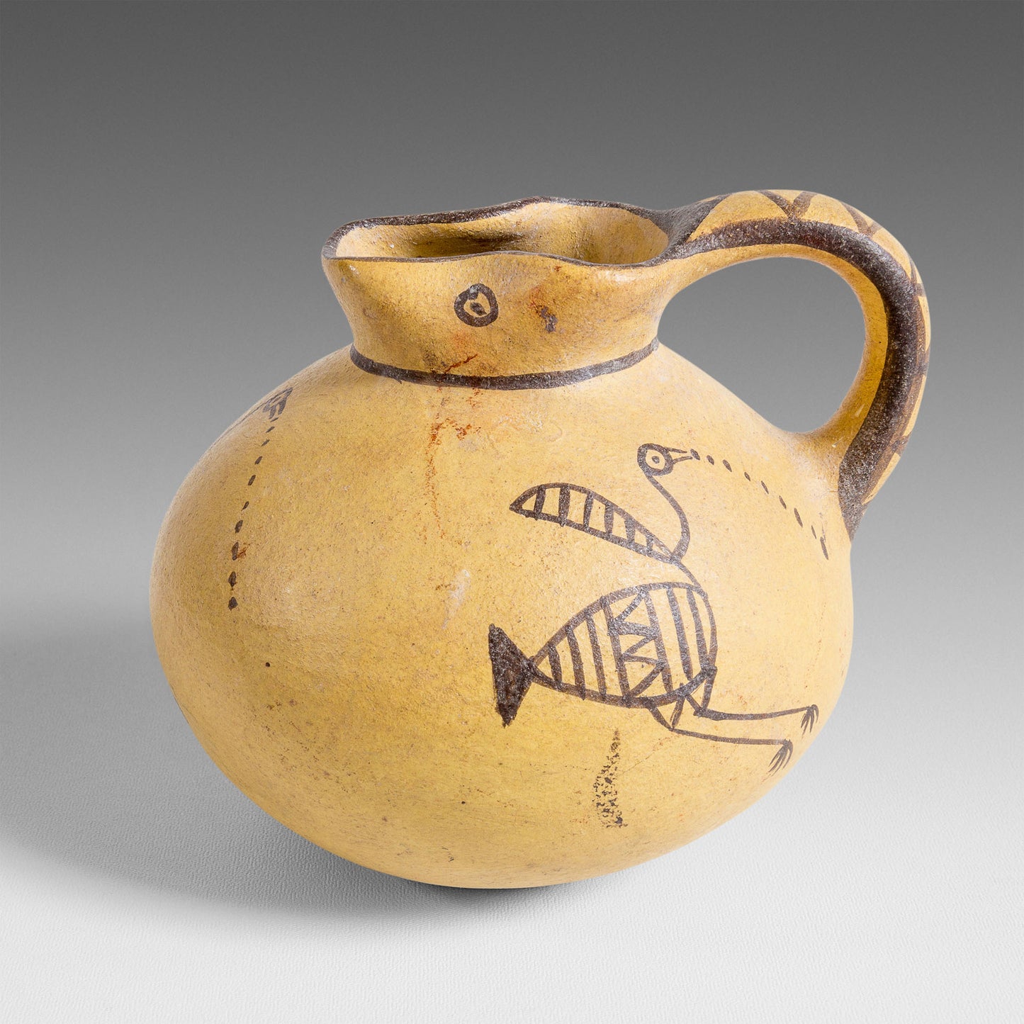 Small bird-decorated jug