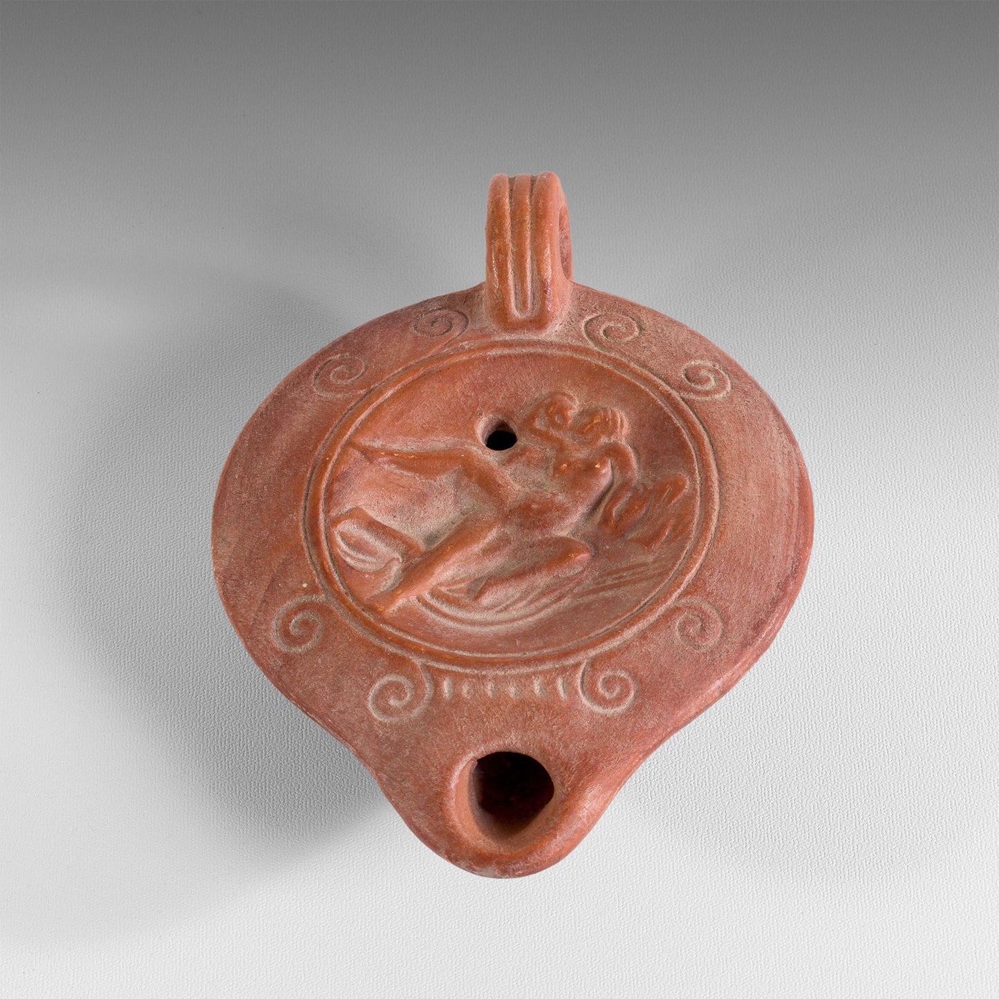 Embracing couple oil lamp